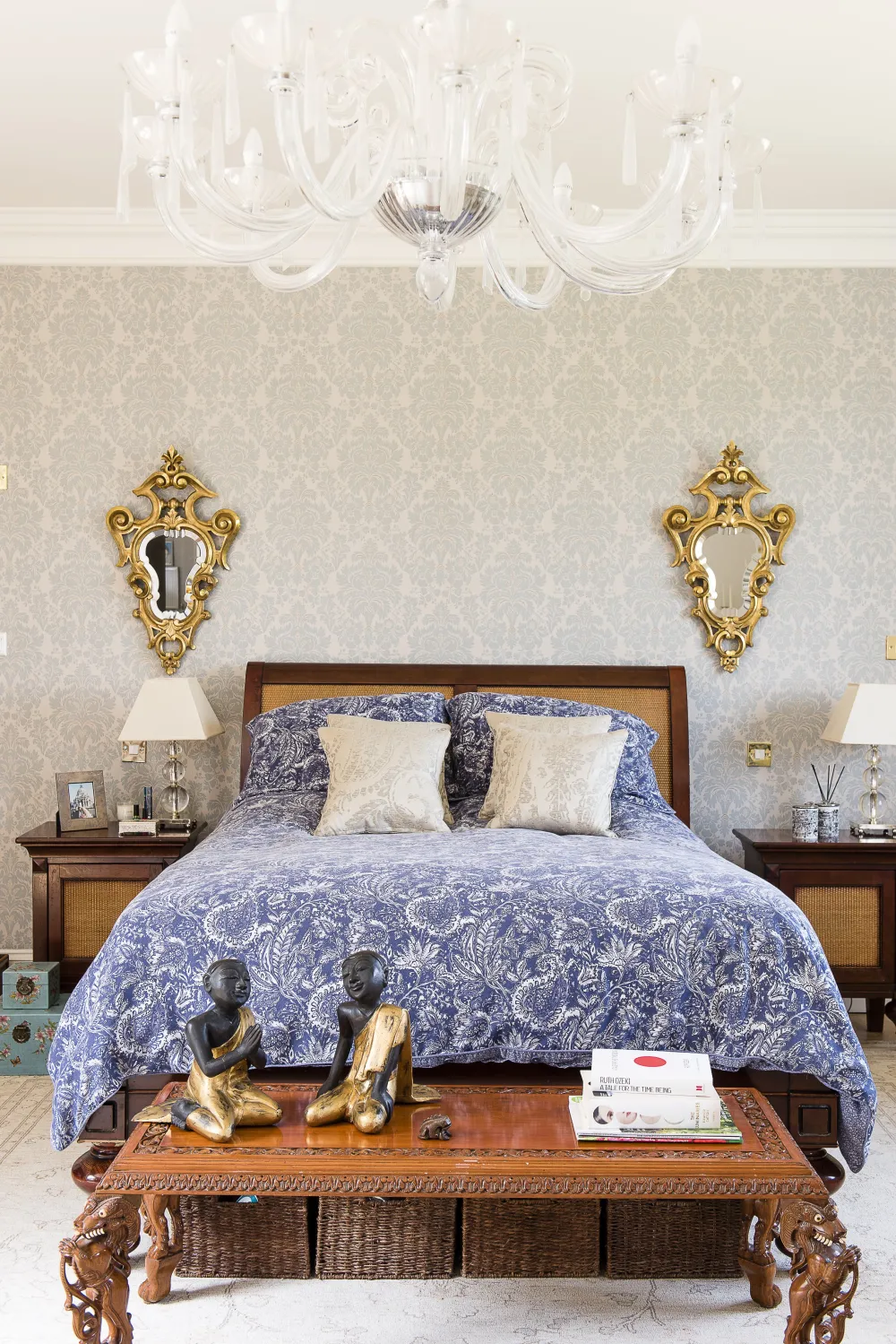 Bedroom with bedside cabinets and antique mirrors