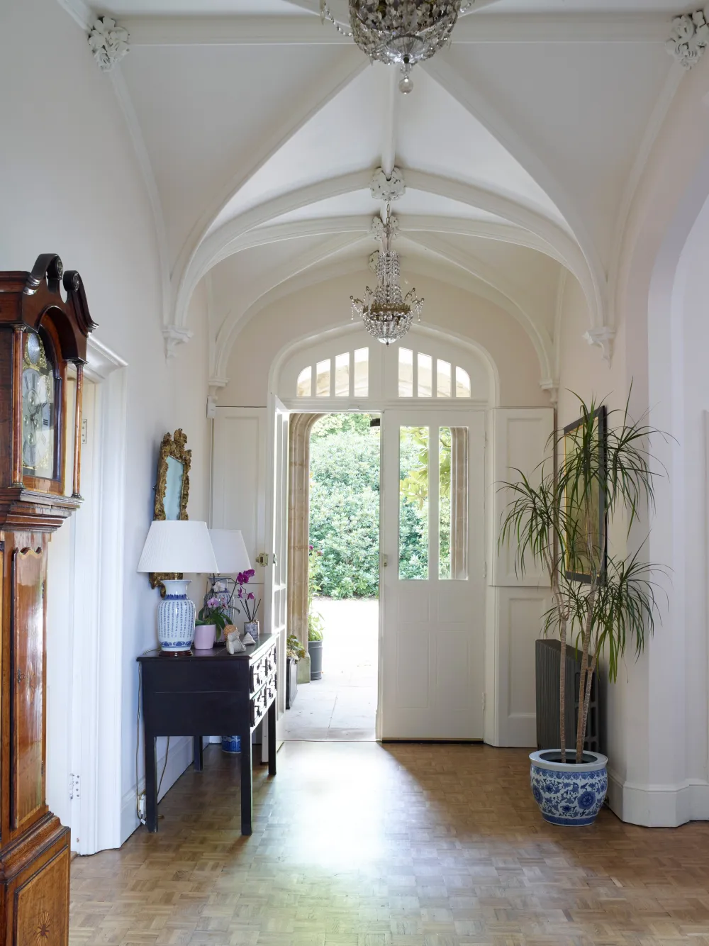 Entrance hallway with console table and grandfather clock