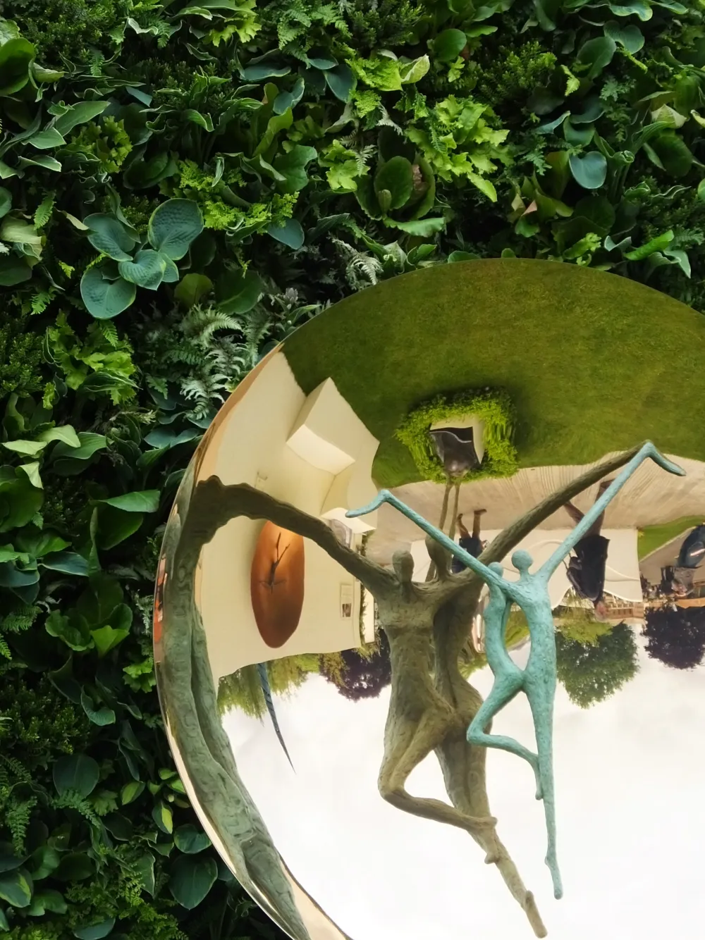 Sculpture by Michael Speller, framed with living wall