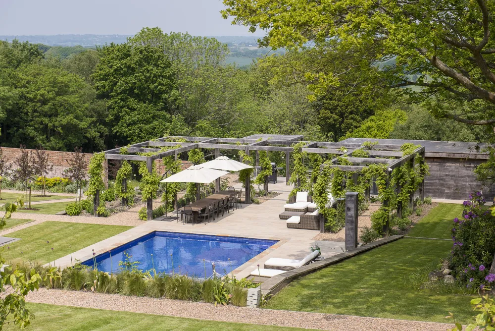 Pool, dining terrace and oak pergola viewed from a height